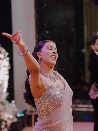 A bride enjoying herself on the dance floor during her Sangeet performance. We capture the energy and confidence of our brides.