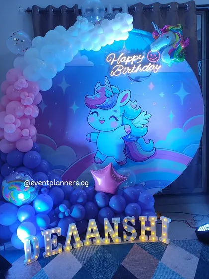 A slightly different angle of the dreamy unicorn birthday decor, highlighting the neon sign.