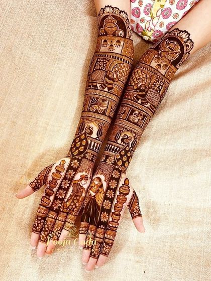 A closer view of the bridal mehendi, highlighting the intricate details of the portraits and the surrounding patterns.