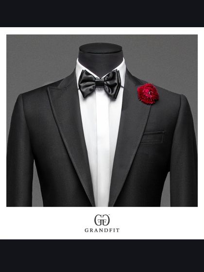 The addition of a simple floral boutonnière transforms the tuxedo for a wedding or special celebration. It is a detail that speaks of romance and occasion.