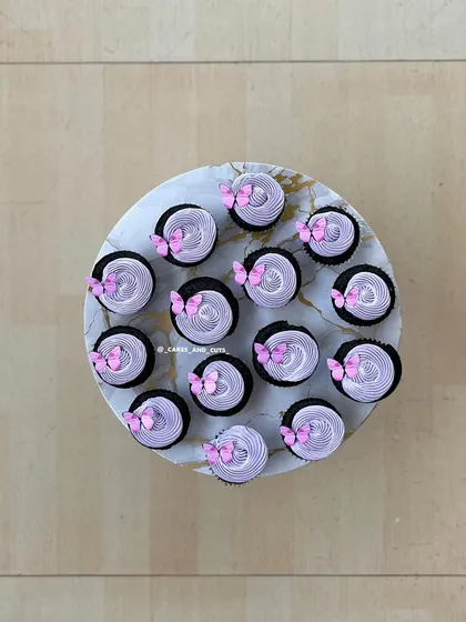 Butterfly cupcakes with pink frosting and delicate wings.
