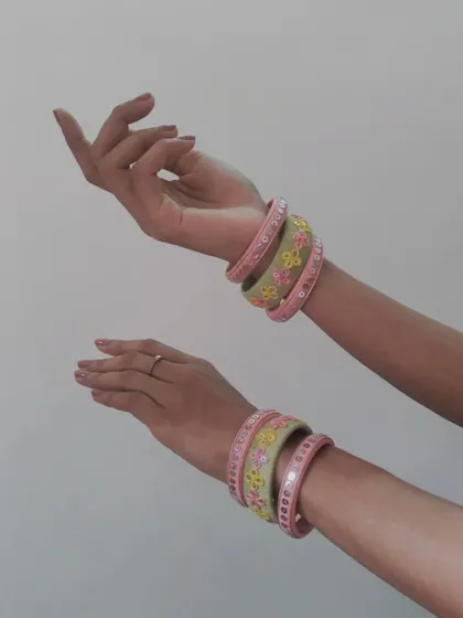 My handmade bangles are designed to be stacked and mixed. This set features pastel green and pink threadwork with delicate floral and sequin details, perfect for matching with sarees or lehengas.