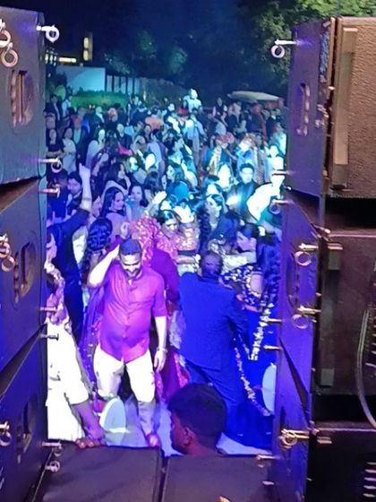 A view from behind the speakers during a baraat. The entire wedding party is dancing their way to the venue, creating an incredible energy that sets the tone for the rest of the celebration.