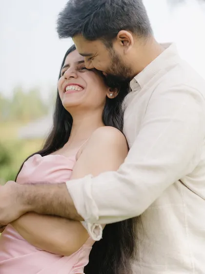 A tender embrace filled with genuine smiles. I aim to create a comfortable space where couples can just be themselves, allowing me to capture their natural affection.
