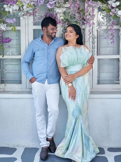Another sweet pose from the same pre-wedding shoot, showing how the 'Snowflake' gown looks from a different angle. The groom's casual attire perfectly complements the dress.