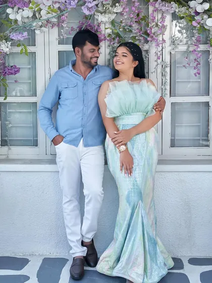 Another sweet pose from the same pre-wedding shoot, showing how the 'Snowflake' gown looks from a different angle. The groom's casual attire perfectly complements the dress.
