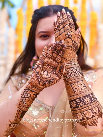 The best part of my job is seeing this smile. This happy bride is showing off her intricate wedding mehendi, a design that we created together to be perfect for her big day.