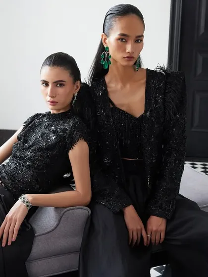 Two stunning all-black looks from Istya's Elan'24 collection. From an organza jacket and pant set to a drape skirt with a tonal top, these pieces redefine monochrome dressing.
