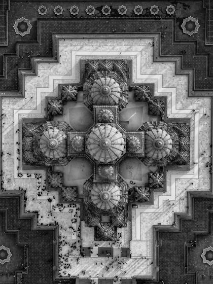 The same top-down view of Akshardham as in the featured section, but presented in black and white. This version emphasizes the structure's pure geometry and texture.