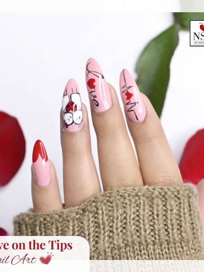 A fun and quirky Valentine's Day design for those who love a bit of humor. This set features a heartbeat line, a "love" script, and a playful cartoon character on a soft pink base, finished with classic red heart tips.