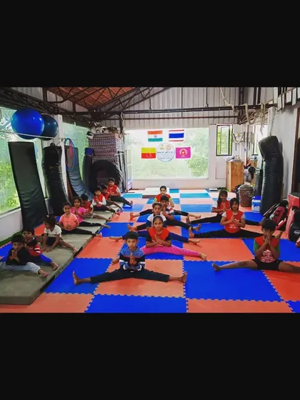 A shot of my kids' class working on their middle splits. Consistent stretching is key to achieving the flexibility needed for gymnastics and preventing injuries.