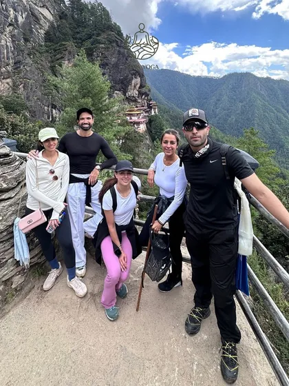 Trekking together to the famous Tiger's Nest monastery in Bhutan. The shared effort and breathtaking views create a powerful sense of community and accomplishment.