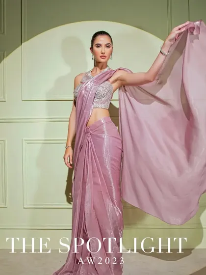A campaign shot of a mauve metallic drape saree, capturing its beautiful flow and shimmering texture.