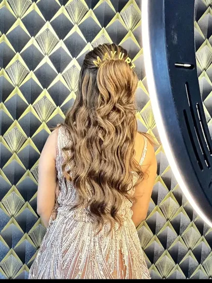A back view showing the client's beautiful hairstyle with a custom clip.