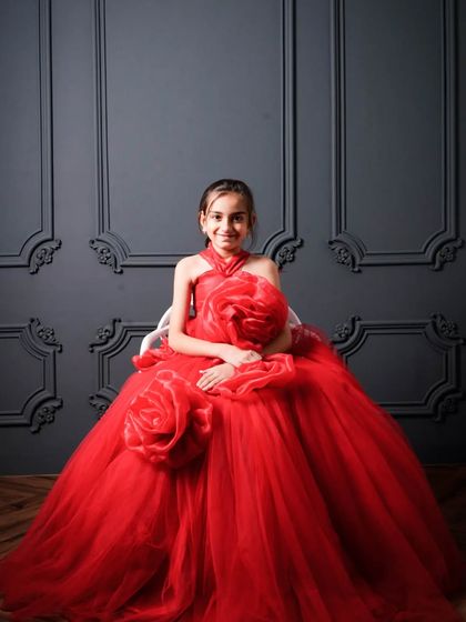 This little princess is ready for her close-up. My studio offers complete makeover packages for kids, including this stunning red floral gown, hair, makeup, and a classic backdrop.