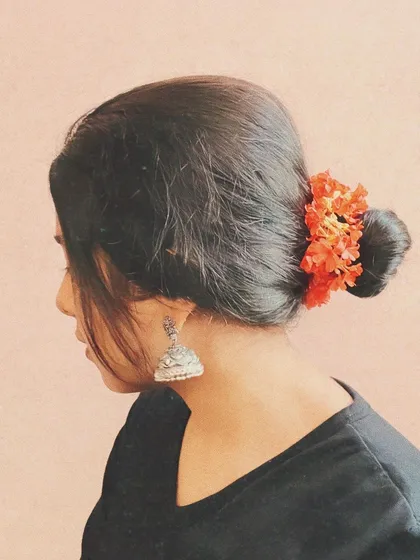 A simple, aesthetic photo showing my connection to my culture. Details like the flowers in my hair and traditional jhumkas are part of my artistic identity.