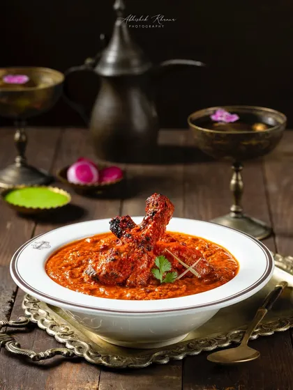 An alternate angle of the Butter Chicken for United Coffee House, showcasing the creamy texture of the gravy and the perfectly cooked chicken.