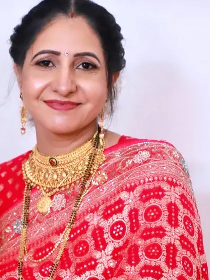 A smiling portrait, showing her looking happy and confident with her elegant makeup.