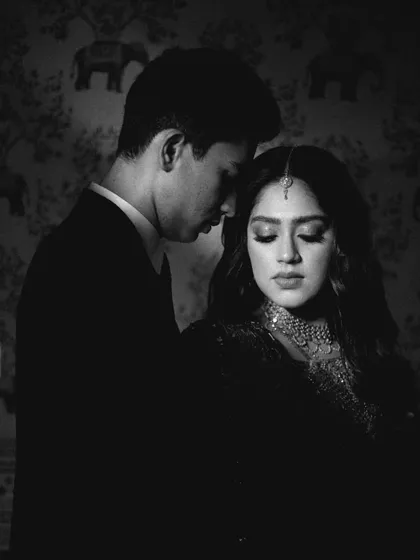 The same portrait in black and white, highlighting the texture and emotion. It creates a completely different, more classic and moody vibe for this reception portrait.