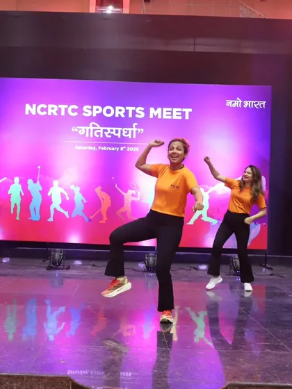 My co-instructor and I enjoying the performance at the sports meet. We love what we do.