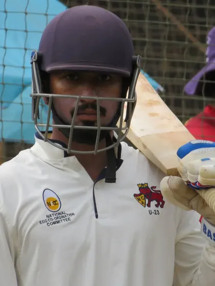 A warrior's focus. Gaurish Jadhav's determination is evident as he prepares to face the next ball.
