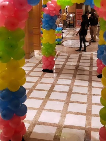 A colorful balloon tunnel entrance for a Cocomelon-themed party, creating a fun and exciting welcome for young guests.