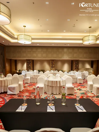 Here, my banquet hall is set up with a head table for a panel discussion or formal address. This demonstrates my ability to cater to specific event formats, ensuring your conference or meeting runs smoothly.