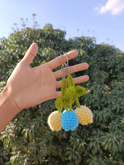 My tulip keychains are a delicate and beautiful accessory. Here they are shown in yellow and blue, but I can create them in any color.