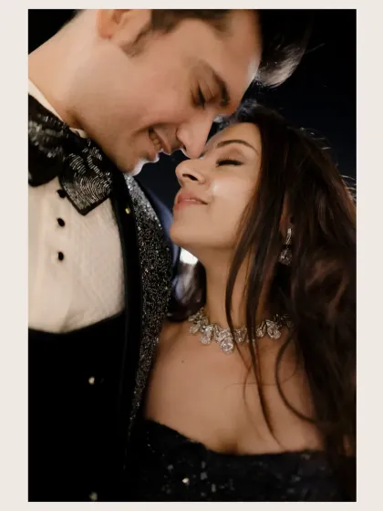 An intimate close-up of the couple, their smiles reflecting the joy and love of their Sangeet night.
