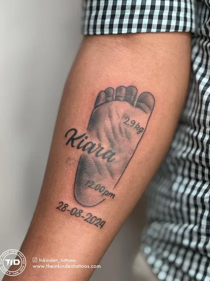 I specialize in immortalizing your most precious memories. This tattoo captures the exact footprint of a client's newborn, complete with their name, birth date, and weight, creating a timeless tribute to a new life.
