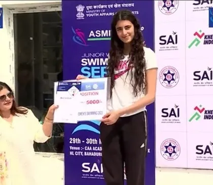 One of my swimmers receiving her cash prize at the Khelo India Series. This recognition from the Sports Authority of India (SAI) highlights the caliber of athletes my program develops.