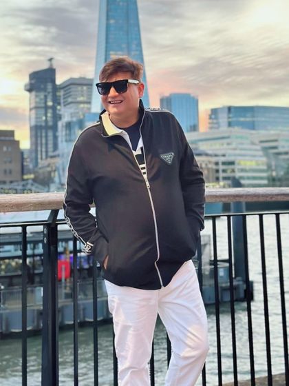 Another smiling shot with the London skyline, capturing the joy of travel and discovery.