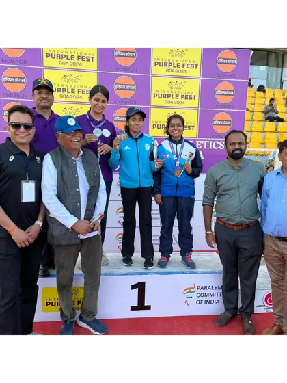 A group photo on the podium at the National Para Athletics Championships. Seeing my athletes succeed is the greatest reward for a coach.