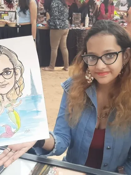 This guest chose a mermaid theme for her caricature at the "Ten Thousand Treasures" market. It's always fun to add a touch of fantasy.