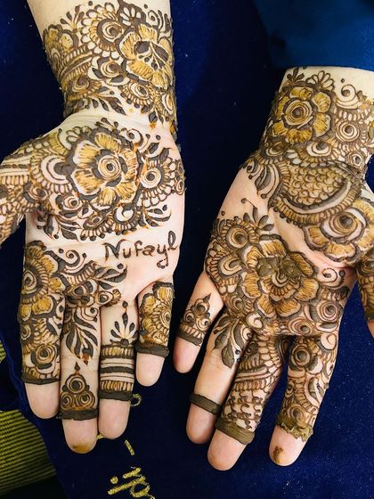 A personalized floral design with the name "Nufayl" hidden among the flowers.