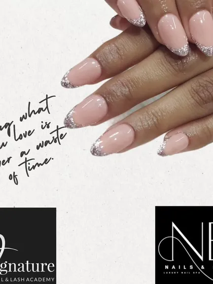 A glamorous update to the French manicure. This design features a soft, natural pink base with a sparkling silver glitter tip for a festive and elegant look.