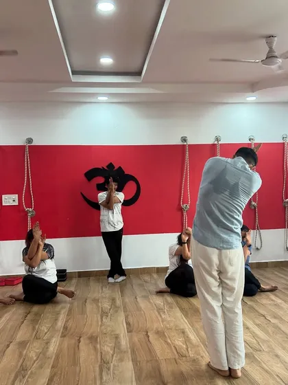 A moment of unity and focus during our Yoga Day celebration. Here, we are practicing Garudasana (Eagle Pose) arms, a stretch that releases tension in the shoulders and upper back.