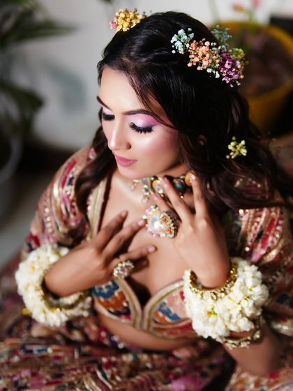 The bride looking down, showcasing the beautiful blend of colours on her eyelids. This is a look you can learn in my upcoming batch!