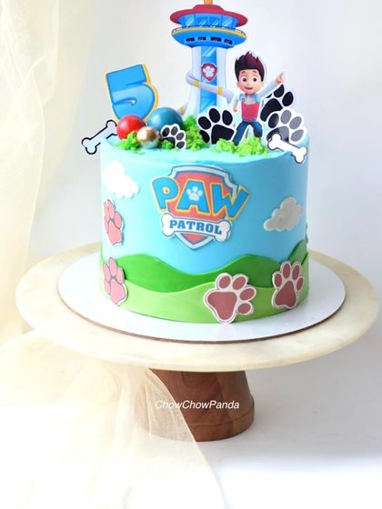A fun Paw Patrol cake for a 5th birthday celebration. I used edible prints of the characters and logo, with buttercream hills and paw prints around the sides. The flavour was Fresh Pineapple.