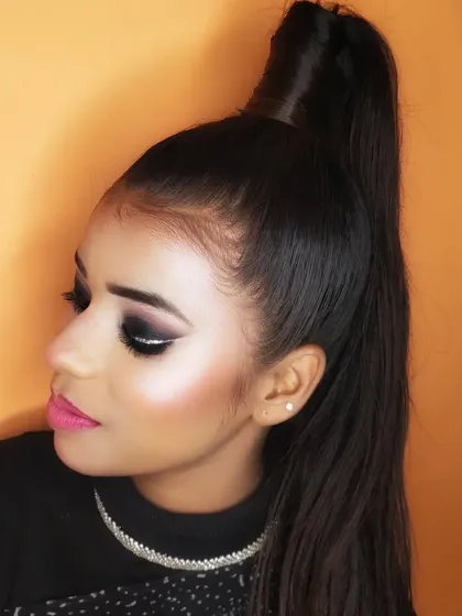 A side profile of the graphic smokey eye, paired with a high ponytail for a very sharp and stylish look.
