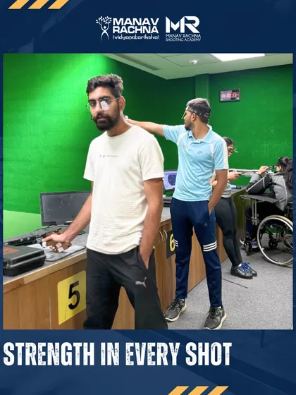 A coach provides a subtle physical adjustment to a para-athlete's posture, showcasing the hands-on, personalized guidance that defines my training. Every shot is an opportunity for strength and improvement.