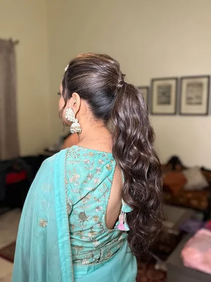 A side view of the messy ponytail, highlighting the texture and volume at the crown.