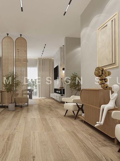 A long corridor in the Japandi-style home features light wood flooring and sculptural decor. The design prioritizes open space and natural materials to create a peaceful flow.