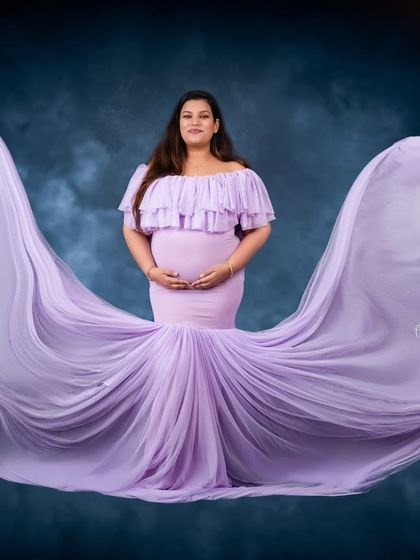 The full effect of our lavender flying gown. The fabric tossed in the air creates a breathtaking shape, turning a simple portrait into a work of art.