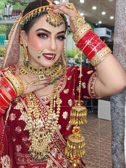 The complete bridal package. This happy bride is wearing one of my most popular red rental lehengas, paired with a full bridal jewellery set, looking absolutely radiant.