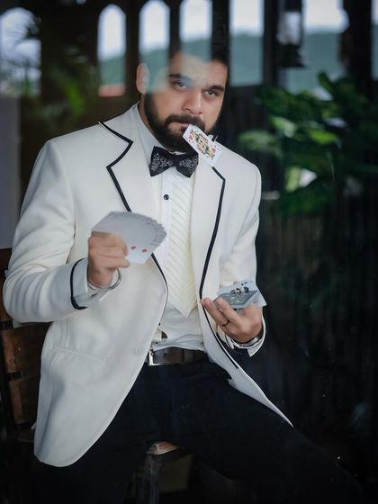 This playful shot with cards adds a layer of personality to the formalwear shoot with Kshitish Date.