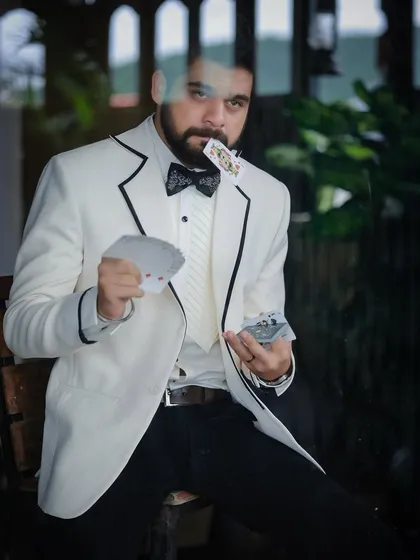 Another shot from the magician-themed series with Kshitish Date, where the formalwear helps build the narrative.