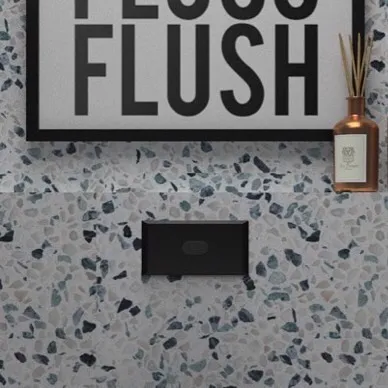 Detail of the terrazzo wall with a flush plate and diffuser, demonstrating a focus on clean, integrated fixtures.