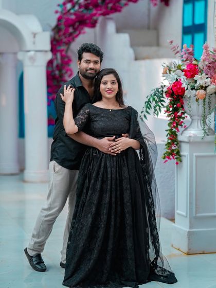 A beautiful portrait of a couple on our Santorini-inspired set, with its clean white and blue aesthetic.