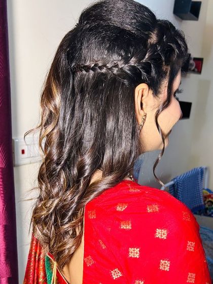 Another view of the half-up, half-down hairstyle, perfect for pre-wedding events.